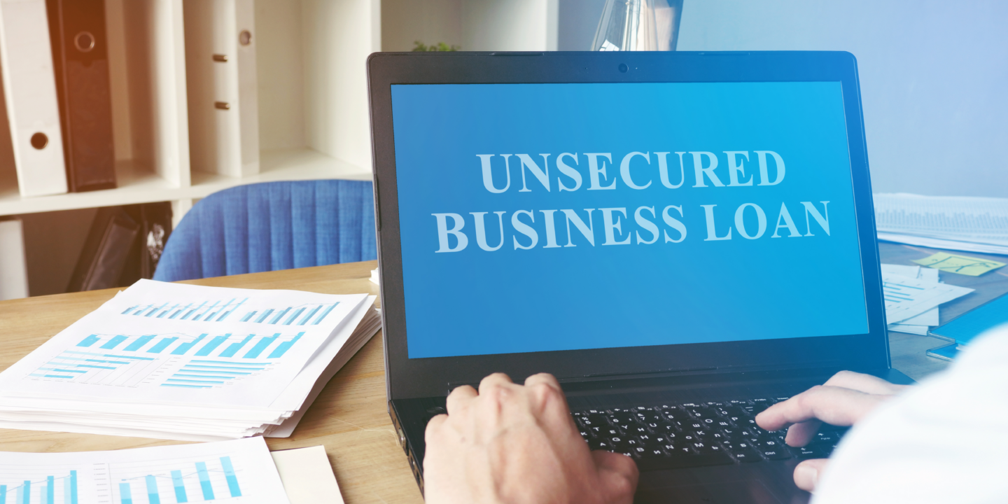 A computer with Unsecured business loan on the screen