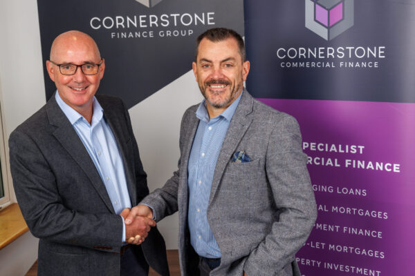 Kevin Morgan our CCO shaking hands with Jon Roberts Head of Real Estate