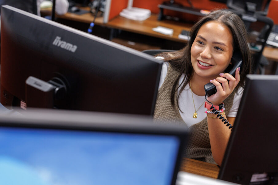 Michelle Sweetman Toledo, Network Engagement and Compliance Adviser on the phone.