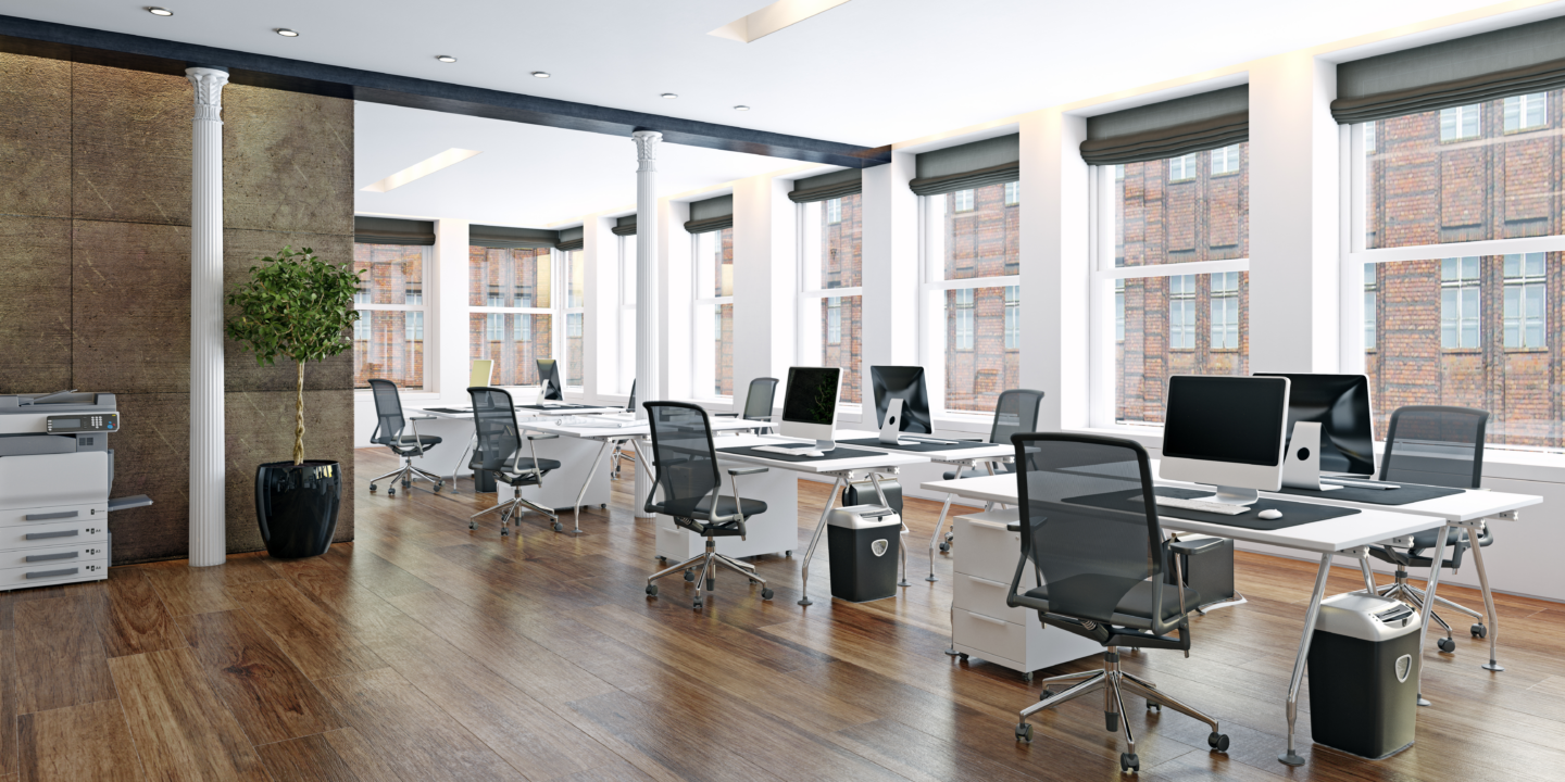 an empty offie with chairs and laptops.