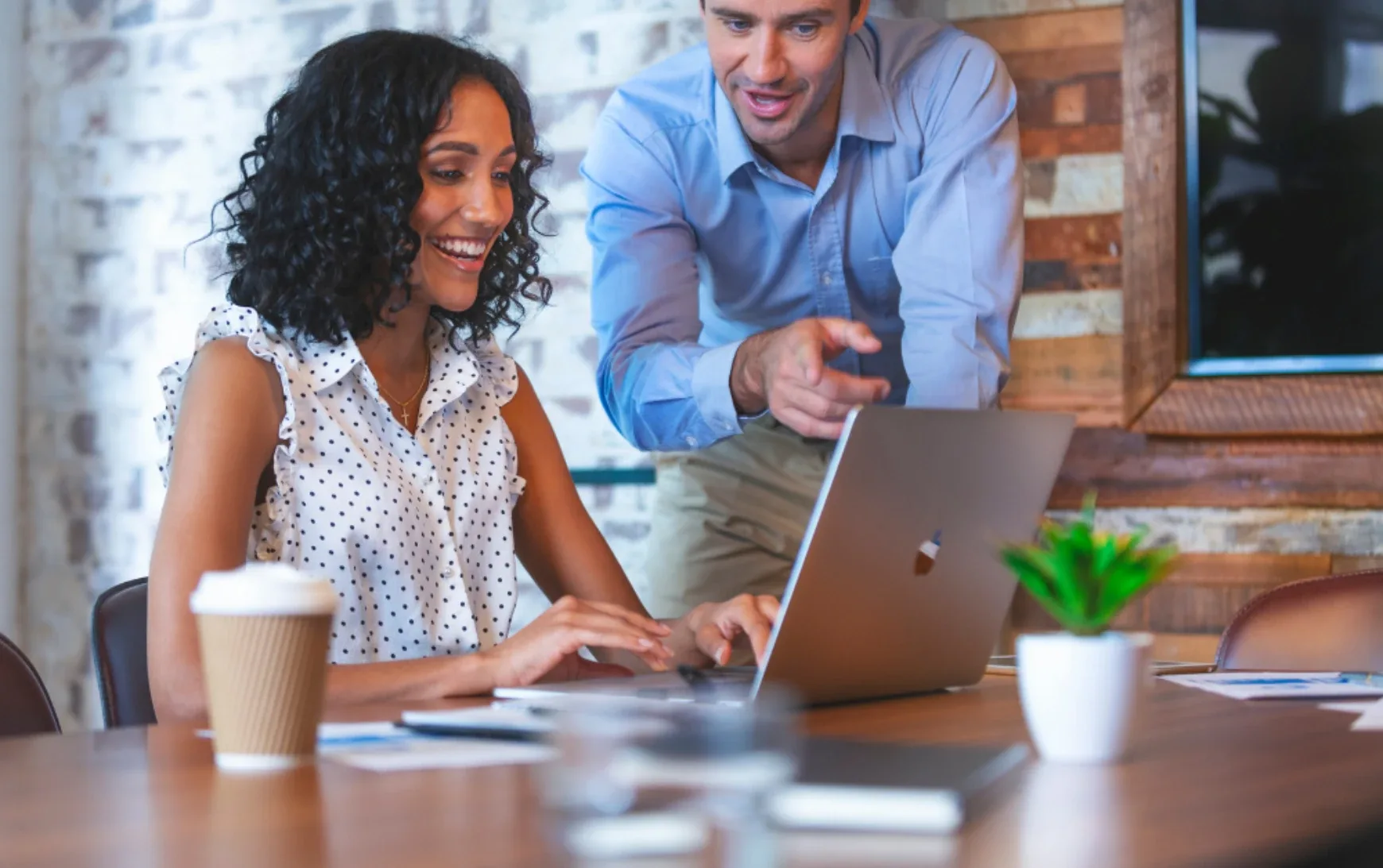 Man and women looking at laptop
